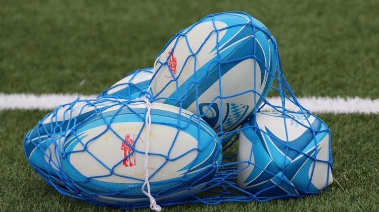 Rugby balls in netted bag