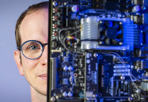 close up shot of researchers face with computing components