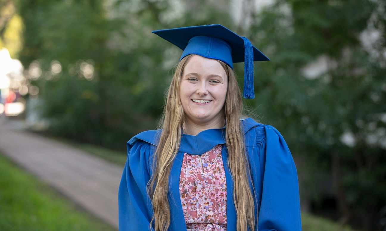 UOW graduate Katana Murphy, pictured in her graduation gown and cap.