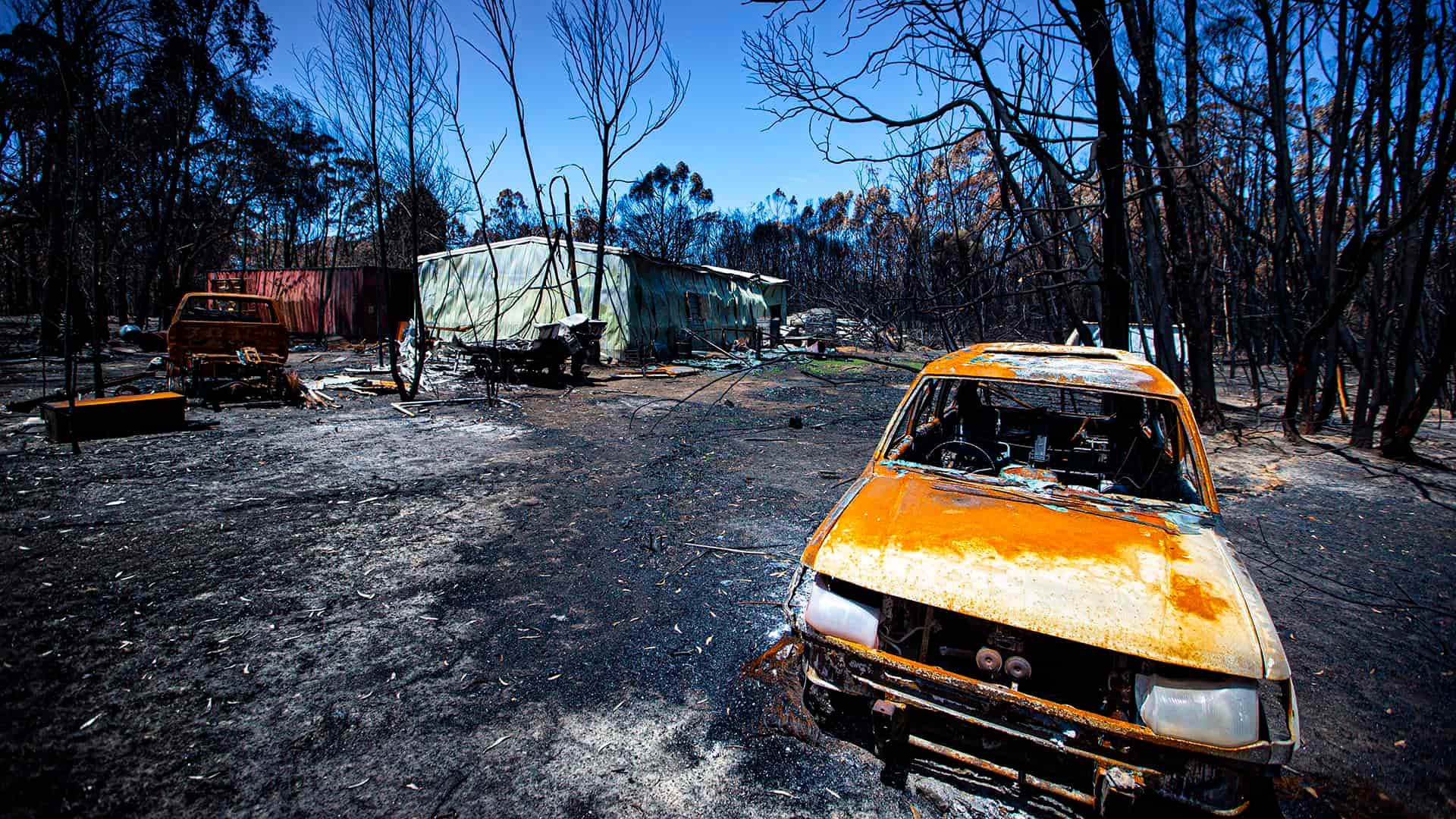 Burnt out cars and sheds following the NSW Black Summer bushfires.