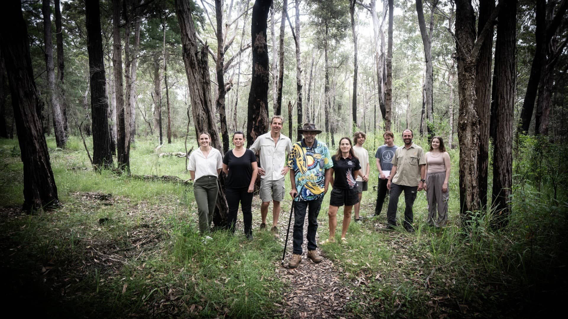 Jessica Davis, Leanne Brook, Anthony Dosseto, Victor Channel, Kat Haynes, Brandon Clarke, Stuart Petty, Nicholas Deutscher and Tahli O'Connor, all pictured standing side by side in bushland on the South Coast. Photo: Paul Jones
