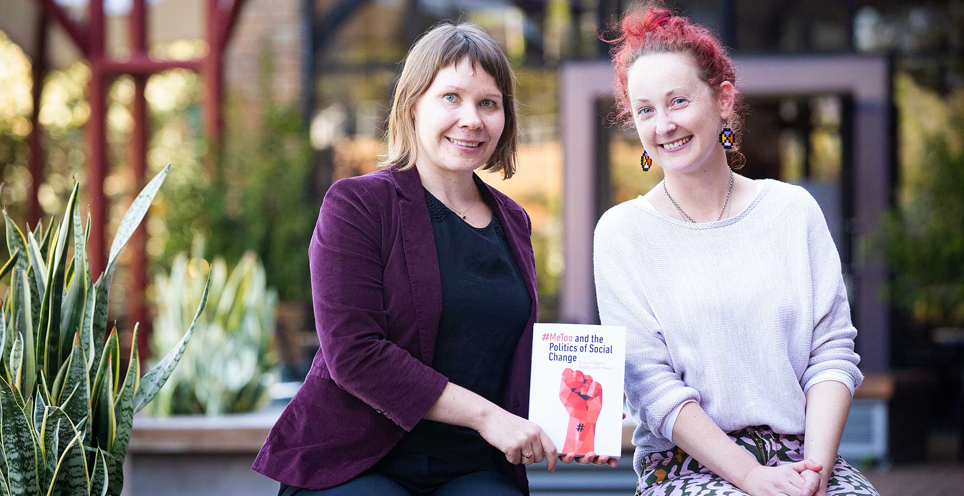 Editors Dr Bianca Fileborn and Dr Rachel Loney-Howes with their new book on the #MeToo movement. Photo: Paul Jones