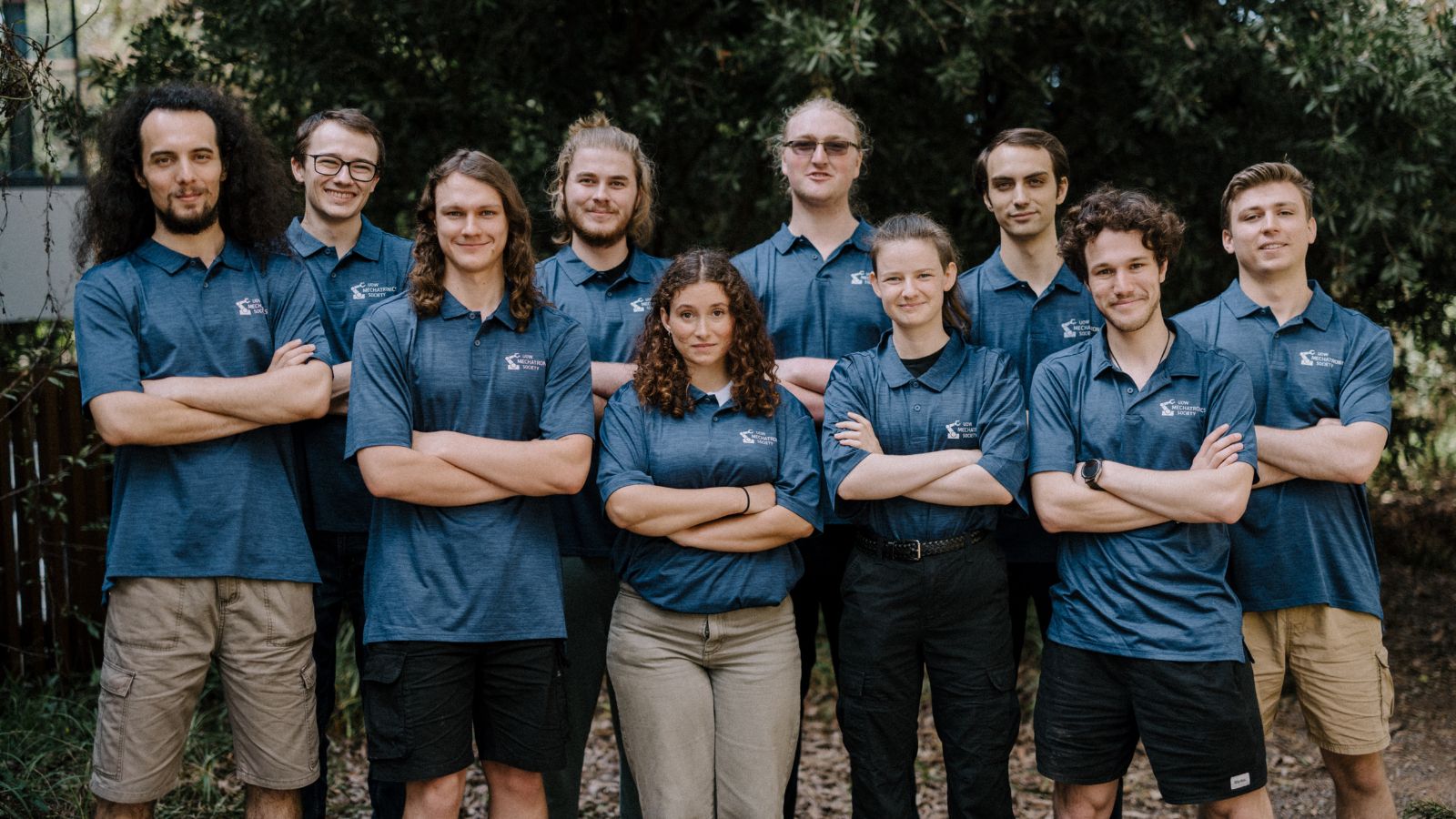 Students from UOW Rover team standing in a group smiling with their arms crossed. Photo: Michael Gray