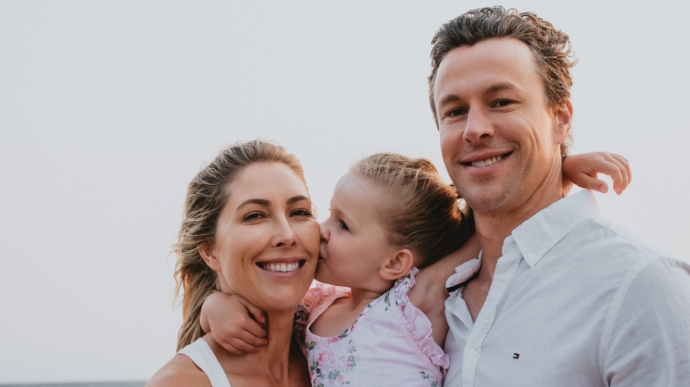 UOW graduate Chelsea Pottenger with daughter Clara and husband Jay