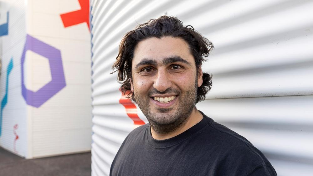 UOW graduate, Dr Alex Badran, smiling at camera