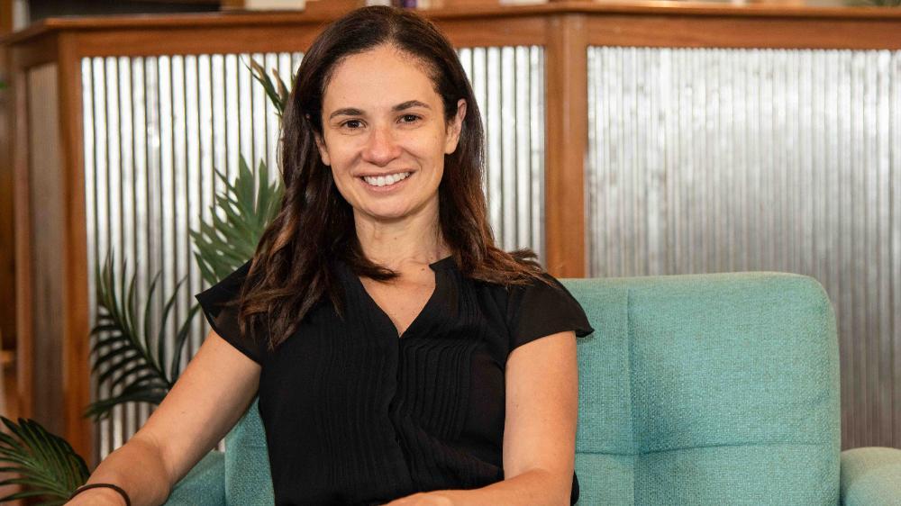 UOW graduate, Leanne Isabella, smiling at camera