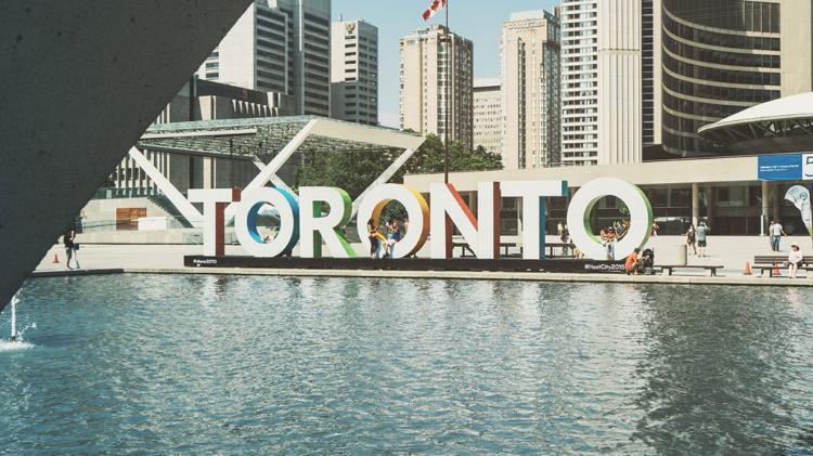 Large letter, spelling out TORONTO on the waters edge
