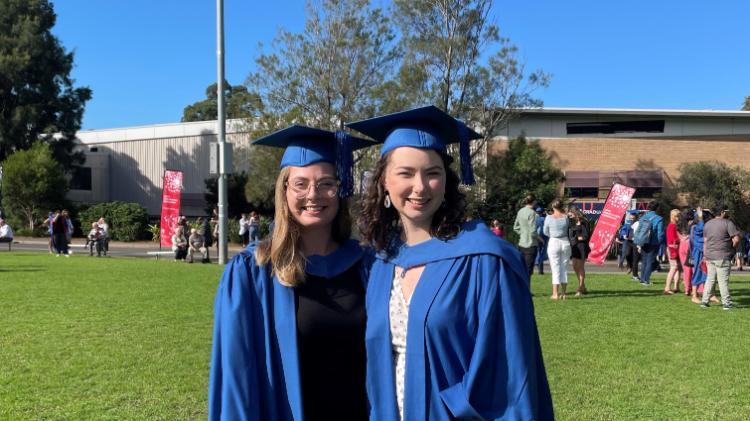 Michaela and friend at graduation