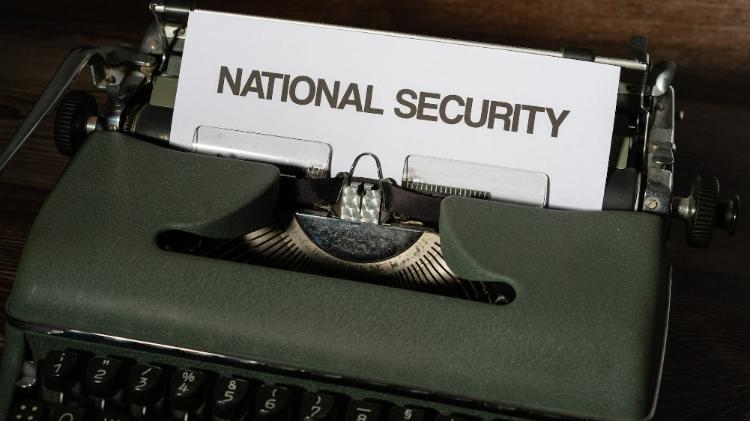 Paper with the words National Security in a typewriter