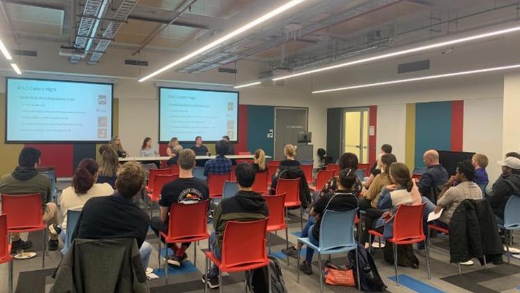 Students are sitting in classroom receiving career advice