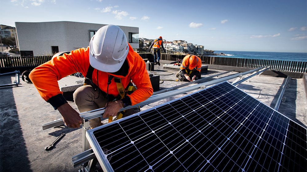 Electrical engineers install a solar grid on rooftop