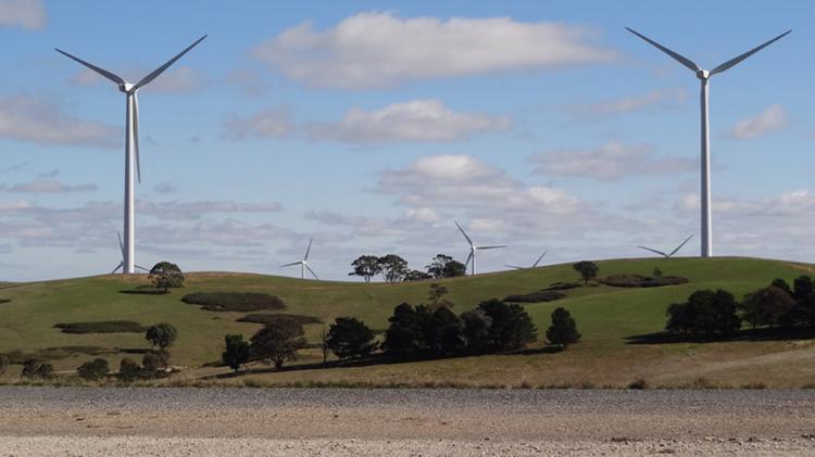 Grassy landscape on a windfarm, with 7 wind turbines