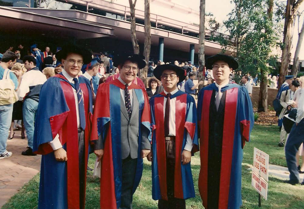 From left to right: Peter Wypych, Peter Arnold with 2 Bulk Solids PhD Graduates Renhu Pan and Zihing Gu