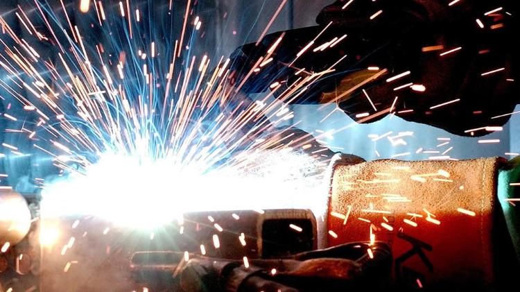 Person welding with Sparks sparking