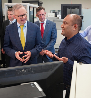 Prime Minister Albanese engaging in a discussion with Obaidur Rahman, a UOW PhD scholar and staff member at the Australian Power Quality Research Centre (APQRC).