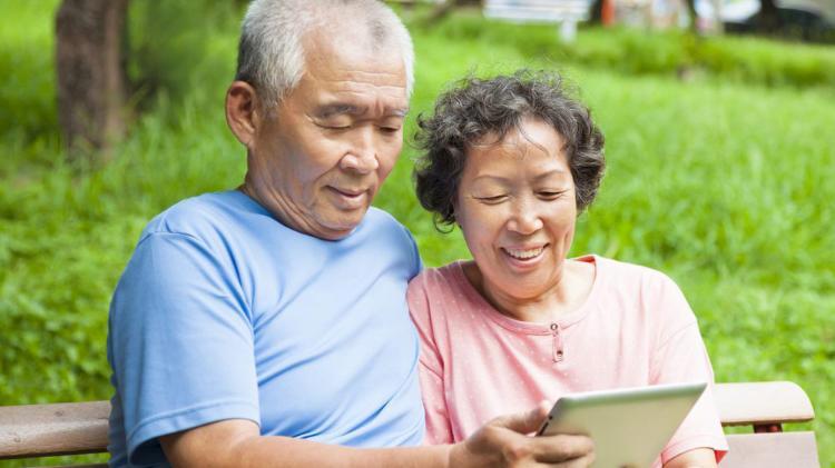 Older man and woman on tablet