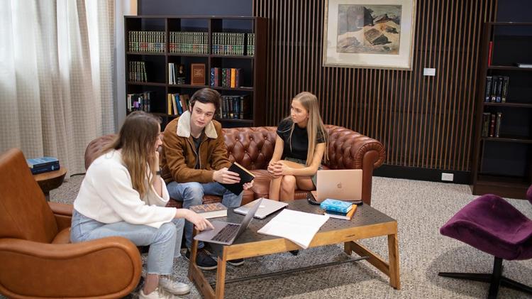 students conversing in student lounge