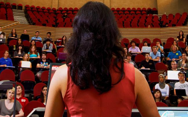 Woman addressing lecture theatre