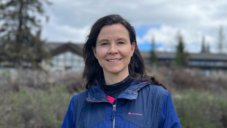 Woman in blue windbreaker jacket