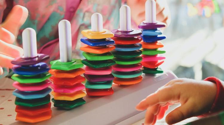 children playing with stacker rings