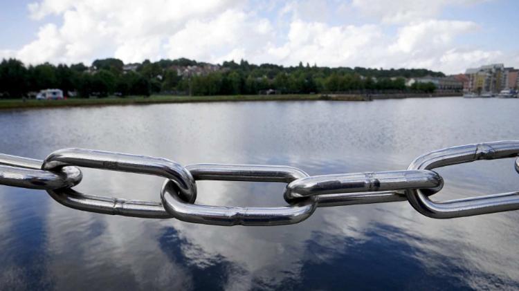 chain link with water in background
