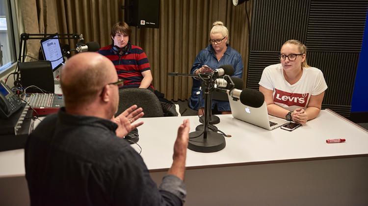 Students and teachers in radio studio