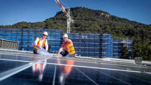 Men on roof installing solar panels