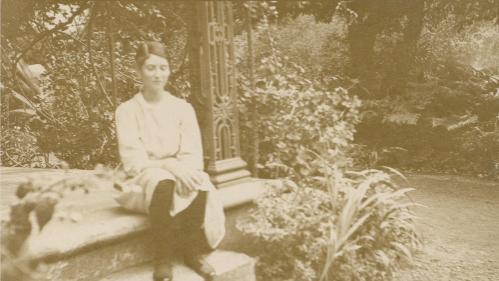 Sepia photograph of Janet Cosh sitting in a garden