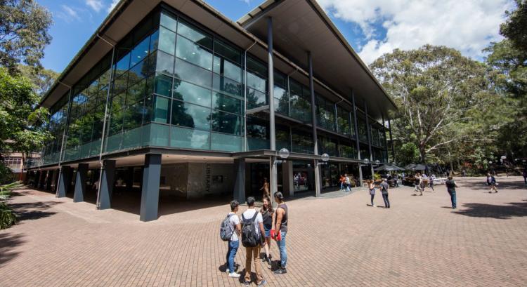 Wollongong Campus Library exterior with students standing outside the entrance