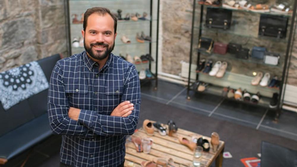 Matt Bernson standing in New York shoe store.