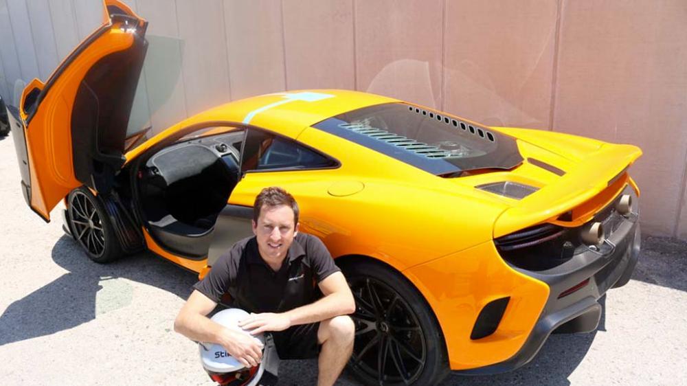 Paul Batten in front of yellow McLaren supercar