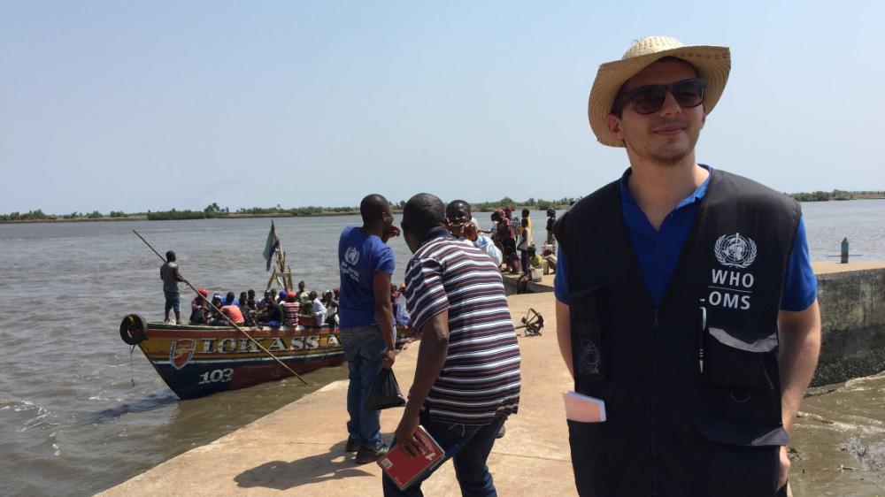 Richard in rural Kambia district, Sierra Leone (2015) during the 2014-2016 Ebola outbreak in West Africa. Here, Richard is part of a field team that is investigating rumors of Ebola cases in a particular area.
