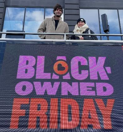 Nicholas and colleagues on top of Black-owned friday bus