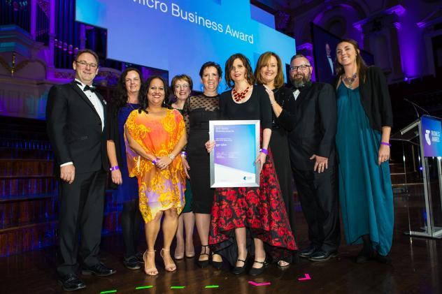 The Gemaker team holding an award