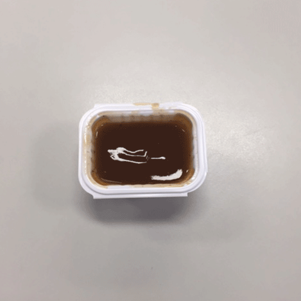 A GIF of chicken nuggets and sauce