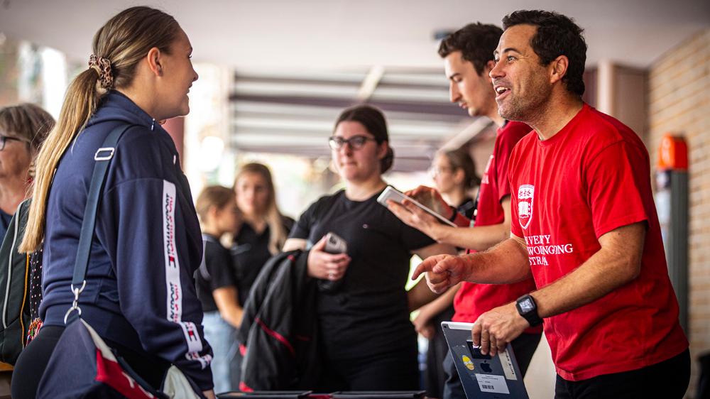 Prospective students talk to UOW staff at a uni event