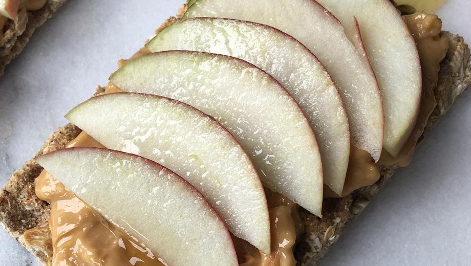 Peanut butter and apple on a cracker.
