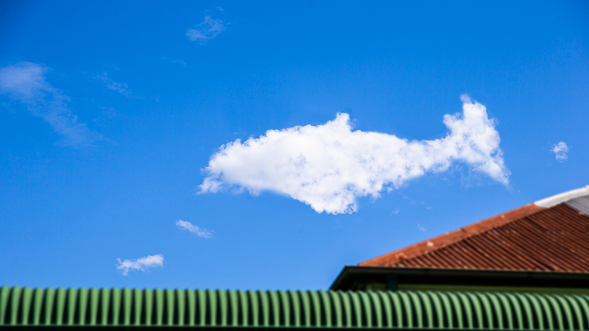 White cloud shaped like a ufo in a blue sky