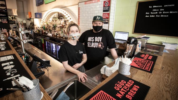 staff behind a bar