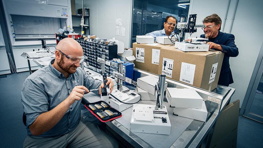 Two researchers work at a lab at UOW campus. Photo: Paul Jones