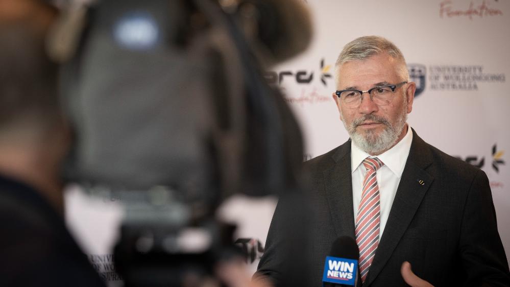 UOW Senior Deputy Vice-Chancellor Professor Joe Chicharo talks to media at a UOW event. Photo: Paul Jones