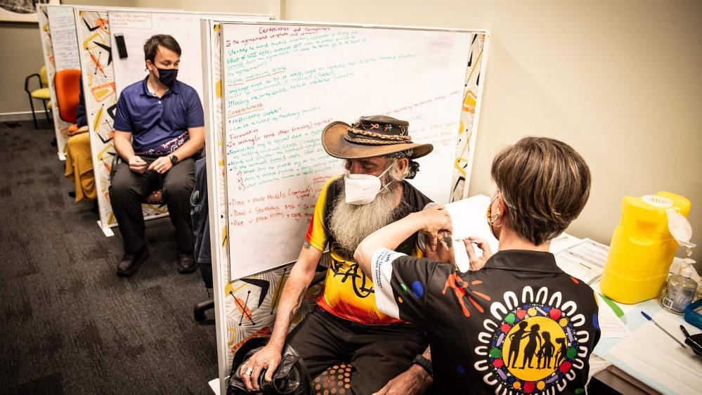 A man is given his COVID-19 shot during a vaccination clinic at Woolyungah. Photo: Paul Jones