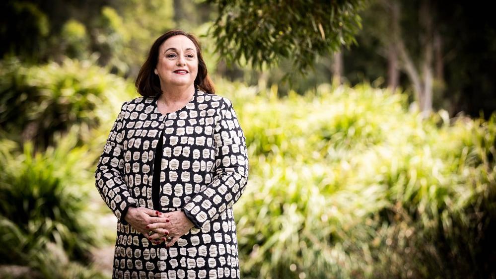 New Vice Chancellor Patricia Davidson stands in front of a line of trees. Photo: Paul Jones