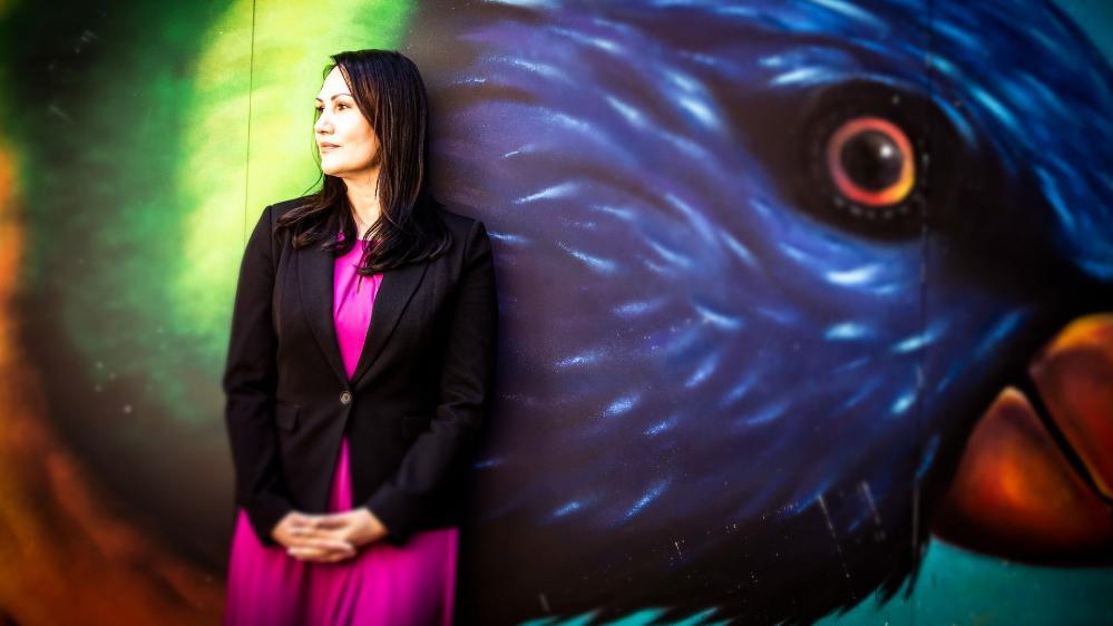 Davina Robson stands in front of a bird mural in Wollongong. Photo: Paul Jones