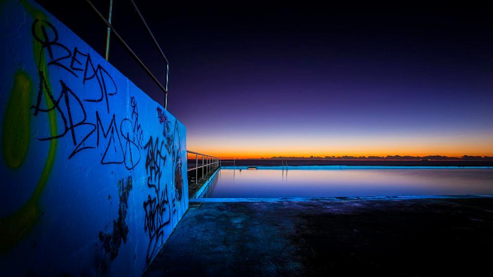 Pools of the Illawarra with graffiti on wall