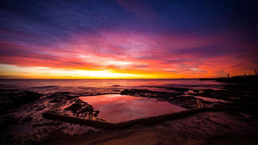Pools of the Illawarra with warm colourful sky