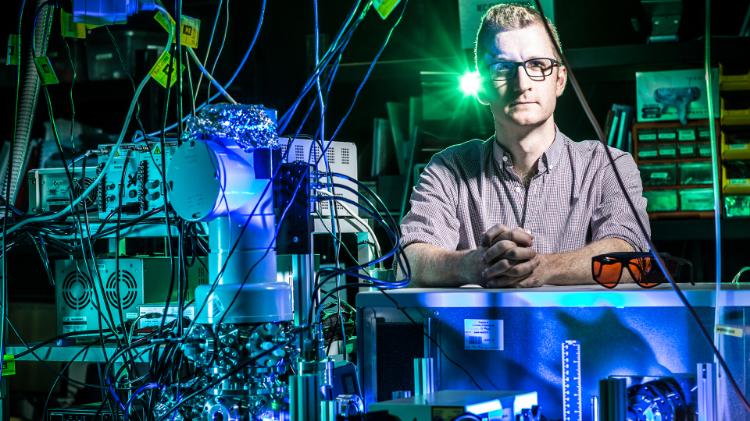UOW Associate Professor Adam Trevitt stands in high tech chemistry lab