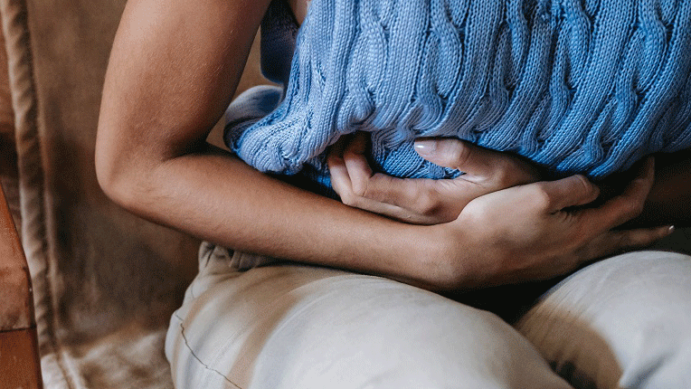 woman holding stomach