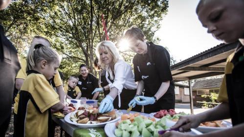 UOW Health Impacts Nutrition researchers serve breakfast to primary school children 