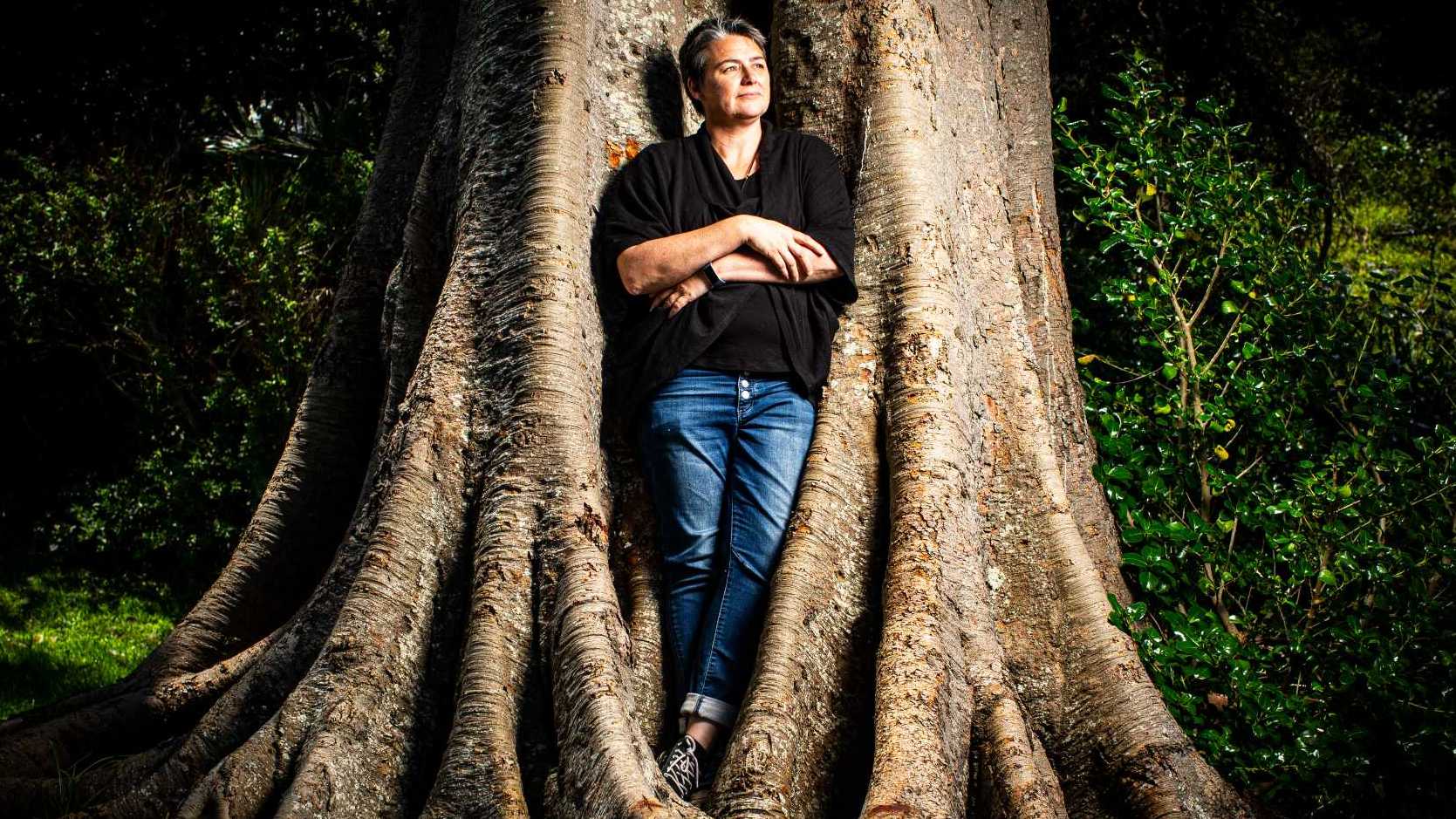 Catherine Moyle standing amongst a large tree